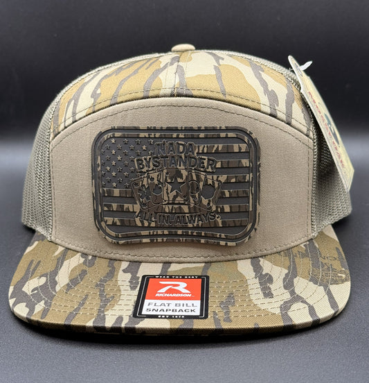 Camouflage cap with a patch and brand logo on a dark background